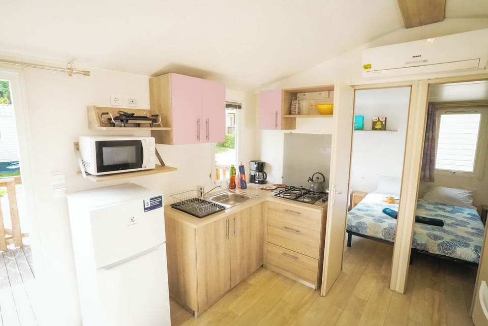 Premium Mobile Home, 3 Bedrooms | Private kitchen | Full-size fridge, microwave, stovetop, highchair