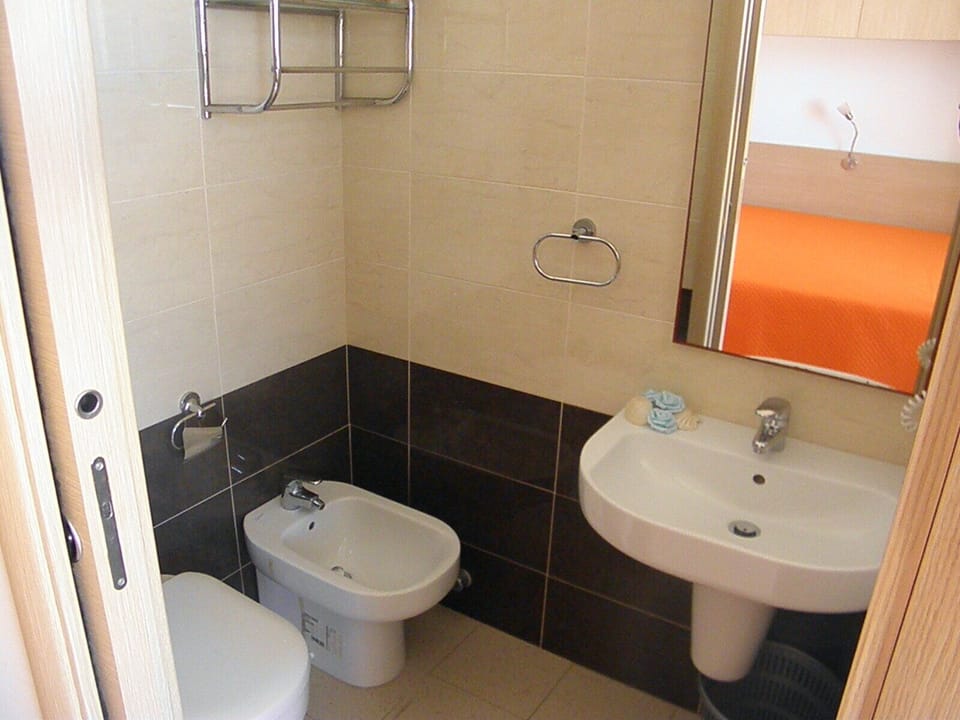 Economy Room, 1 Double Bed | Bathroom | Shower, bidet, towels