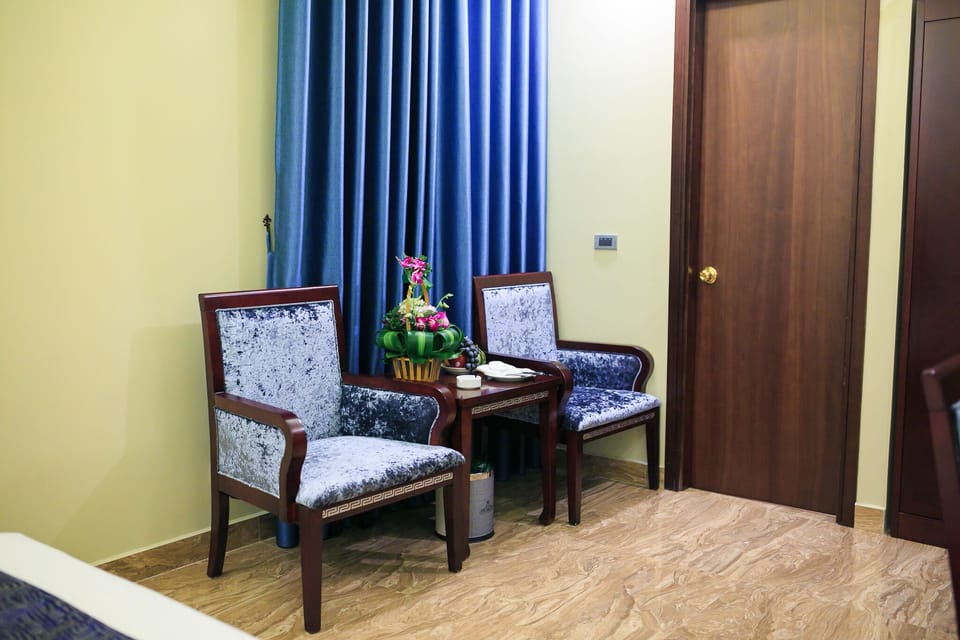 Superior Double Room, Bathtub | Living area | 32-inch LCD TV with cable channels, TV