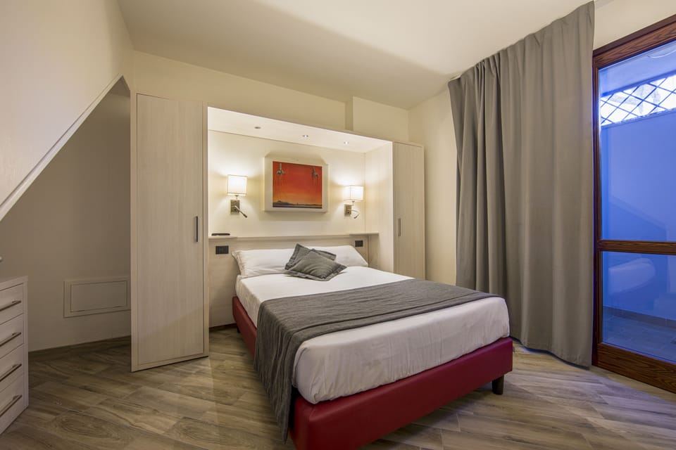 Deluxe Apartment | 1 bedroom, down comforters, in-room safe, blackout drapes