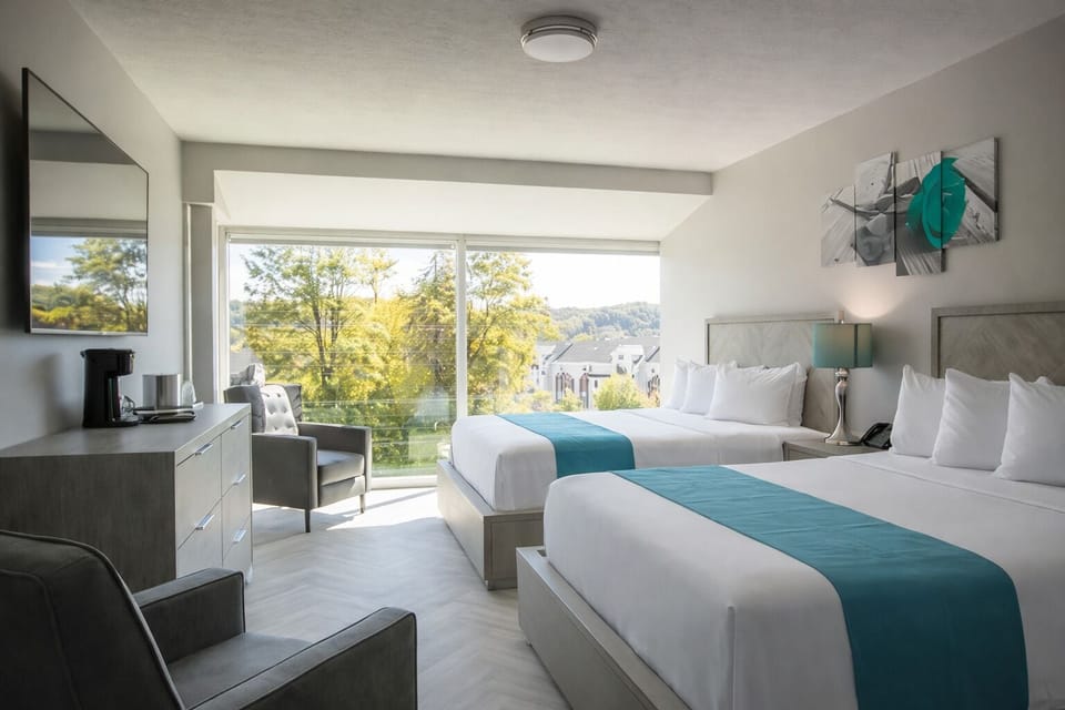 Luxurious Room w/ Two Queen Beds, 65'' TV, Complimentary Drinks - Non-smoking | Egyptian cotton sheets, premium bedding, down comforters, pillowtop beds