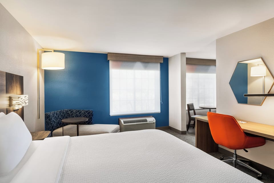 Suite, 1 King Bed | Desk, iron/ironing board, cribs (free), WiFi (free)