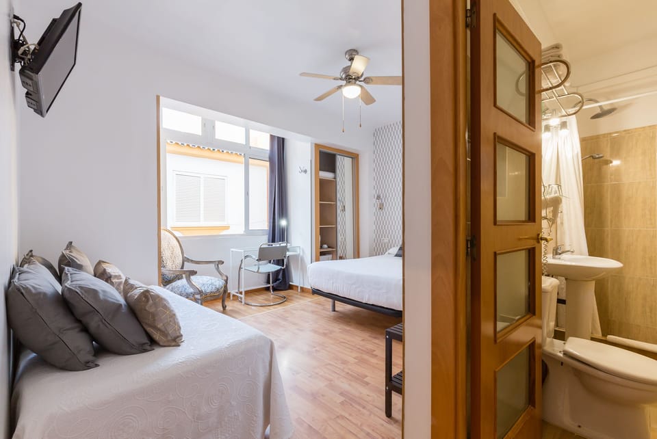 Triple Room | Minibar, in-room safe, desk, blackout drapes