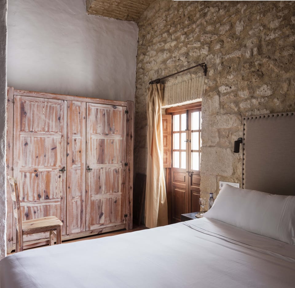 Minibar, desk, bed sheets