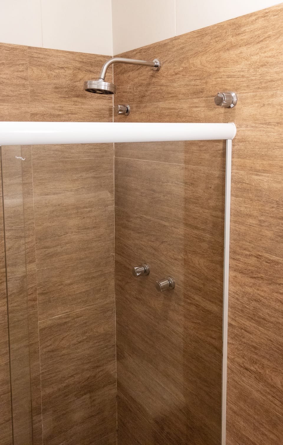 Shower, rainfall showerhead, hair dryer, towels