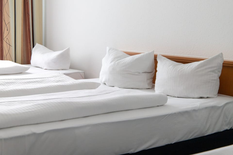 Quadruple Room | Hypo-allergenic bedding, desk, blackout drapes, iron/ironing board