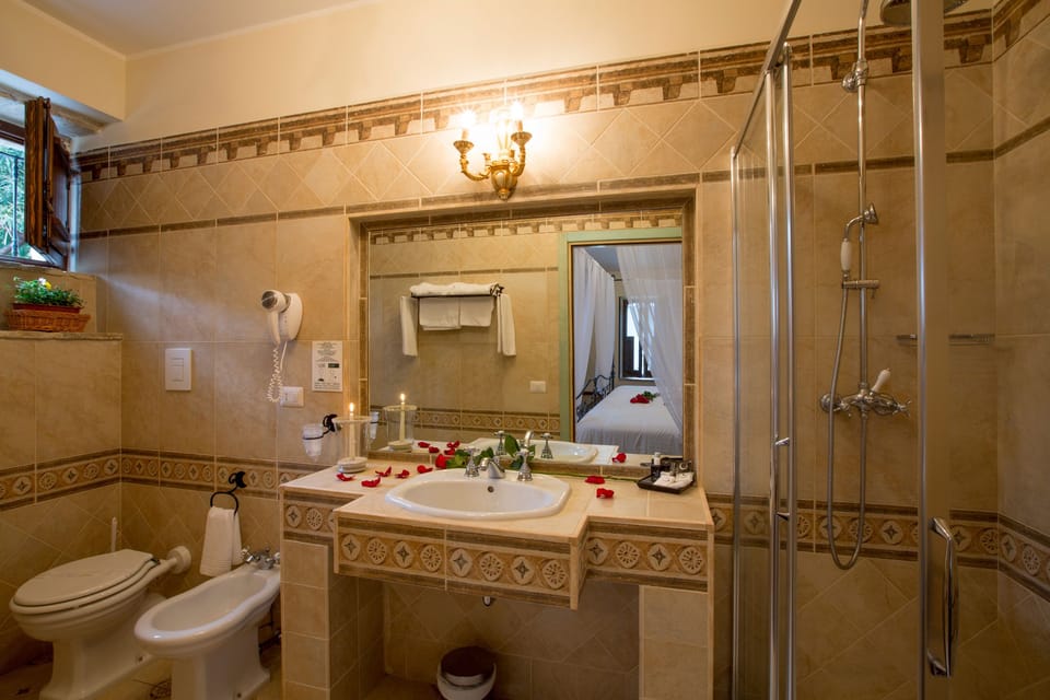 Bathtub, slippers, bidet, towels