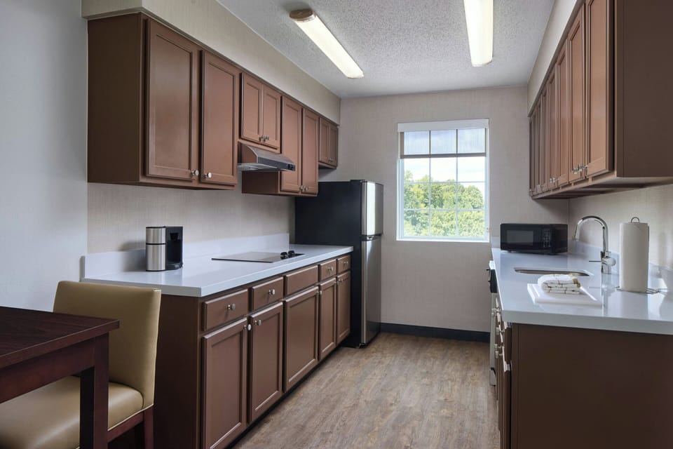 Executive Suite, 1 King Bed | Private kitchen | Coffee/tea maker, full-size fridge, microwave, stovetop