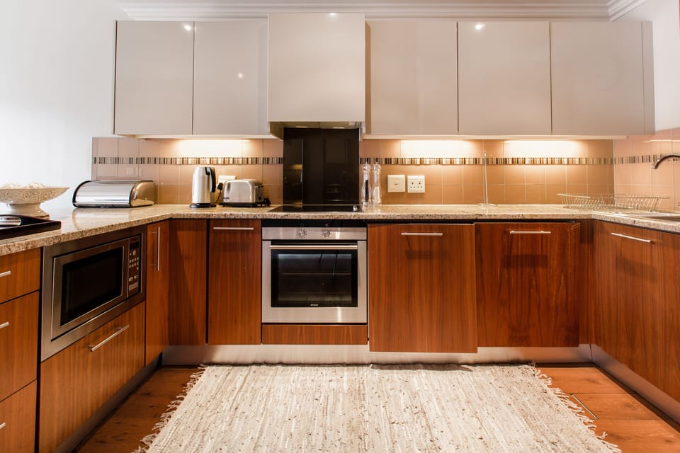Signature Apartment | Private kitchen | Full-size fridge, oven, stovetop, electric kettle