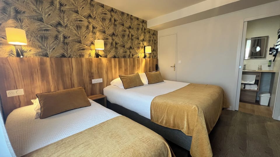 Triple Room | Desk, blackout drapes, free cribs/infant beds, free WiFi