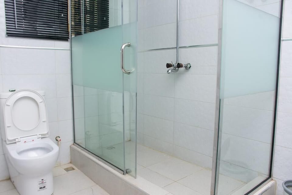Standard Room | Bathroom | Shower, towels, soap, toilet paper