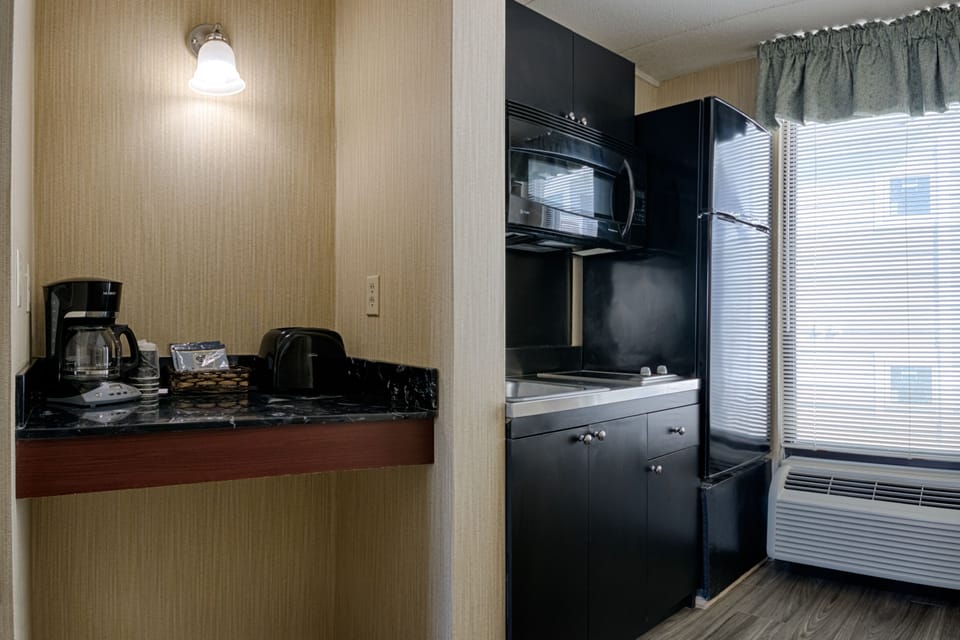 Room, Kitchenette (Efficiency, King Bed & One Double Bed) | Private kitchenette | Fridge, microwave, coffee/tea maker