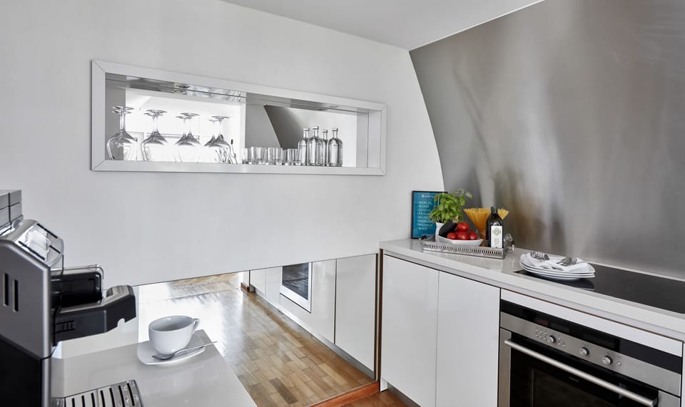 Penthouse Suite | Private kitchen | Microwave, stovetop, electric kettle, cookware/dishes/utensils
