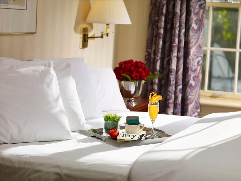 Desk, laptop workspace, blackout drapes, iron/ironing board