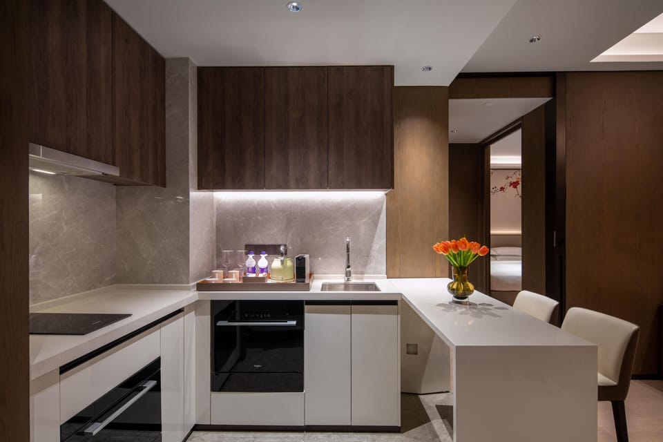 Deluxe Suite, 1 King Bed | Private kitchen | Mini-fridge, cleaning supplies, paper towels
