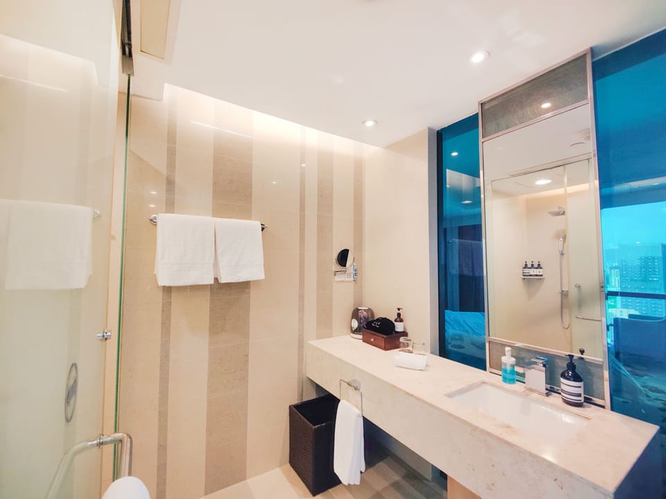 Designer toiletries, hair dryer, bathrobes, slippers