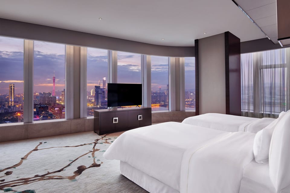 Premium bedding, down comforters, minibar, in-room safe