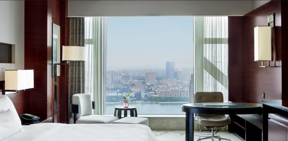 Premium bedding, down comforters, minibar, in-room safe
