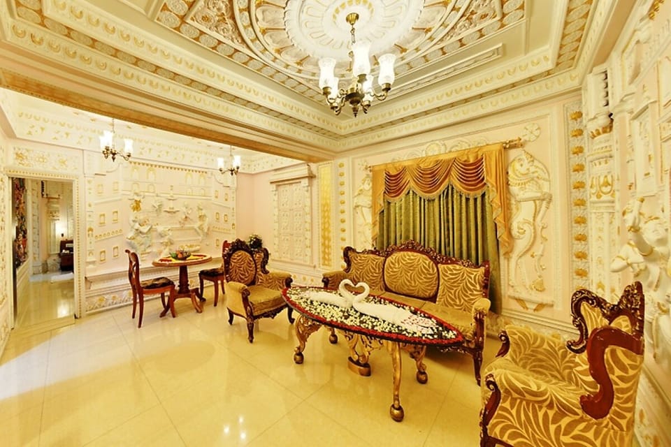 Deluxe Single Room, 1 King Bed | Living area | 50-inch LCD TV with digital channels, TV, DVD player