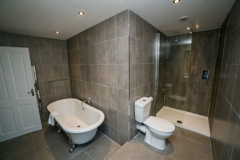 Suite | Bathroom | Designer toiletries, hair dryer, towels