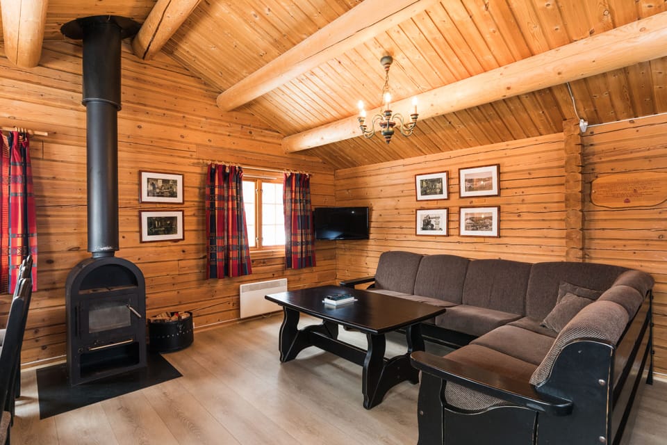 Comfort Cabin, Multiple Beds | Living area | 32-inch flat-screen TV with cable channels, TV