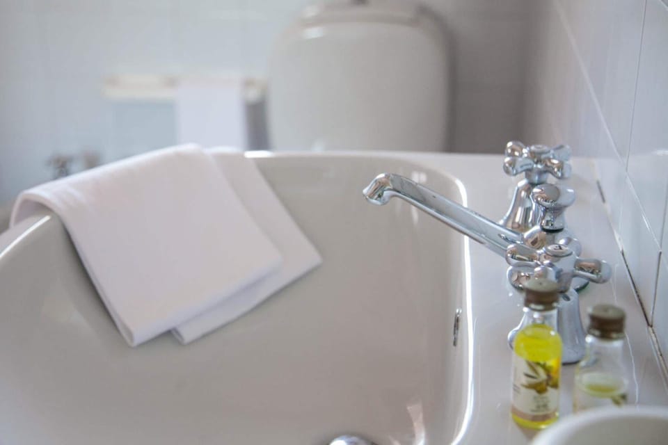 Shower, rainfall showerhead, hair dryer, towels