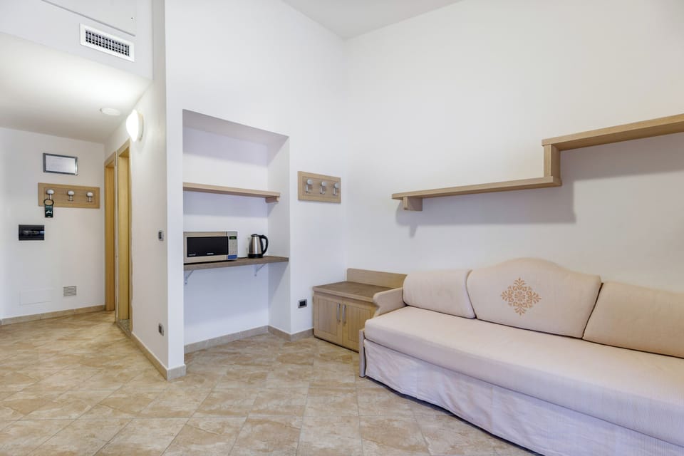 Apartment, 1 Bedroom (Prestige) | Living area | 20-inch flat-screen TV with cable channels, TV, table tennis