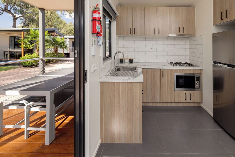Standard 2 Bedroom Cabin - Sleeps 6 | Living area | 52-cm TV with digital channels