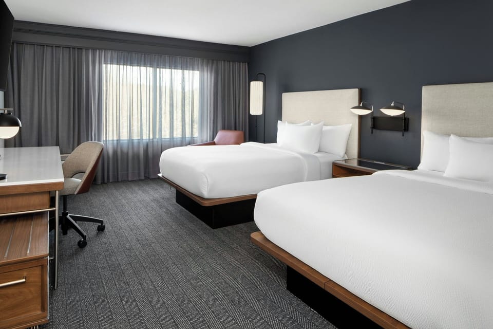 Premium bedding, down comforters, desk, laptop workspace