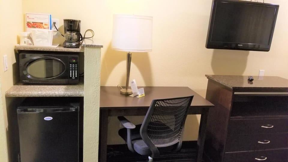 Desk, laptop workspace, blackout drapes, iron/ironing board