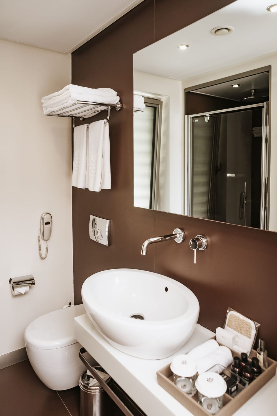 Shower, hair dryer, slippers, towels