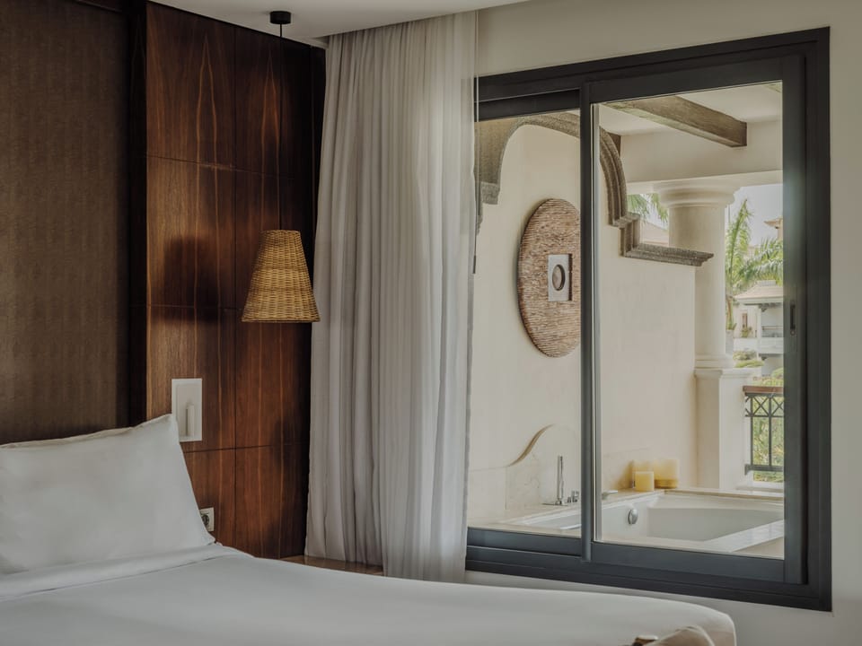 Red Level Junior Suite Ocean Partial View with Whirlpool | Premium bedding, minibar, in-room safe, blackout drapes