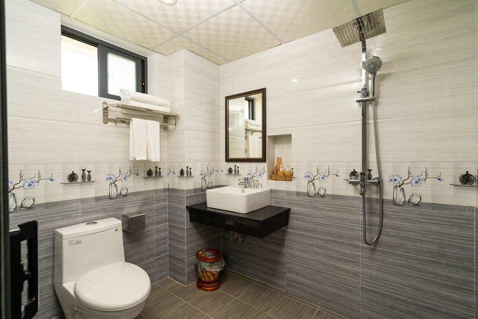 Shower, free toiletries, hair dryer, slippers
