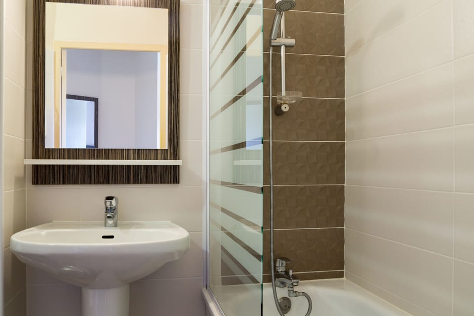 Shower, free toiletries, hair dryer, towels