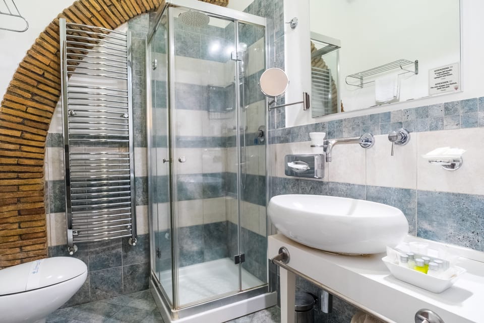 Shower, rainfall showerhead, designer toiletries, hair dryer