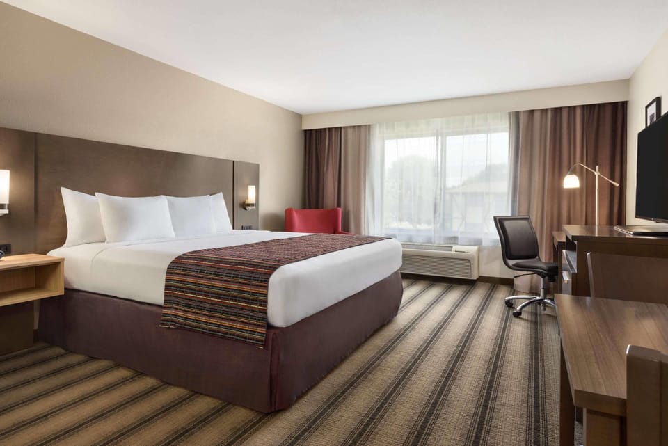 Hypo-allergenic bedding, down comforters, desk, laptop workspace