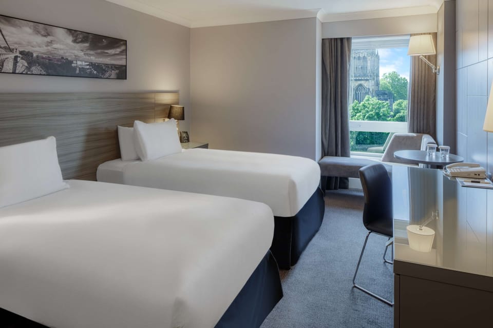Twin Guest Room | Hypo-allergenic bedding, in-room safe, desk, blackout drapes