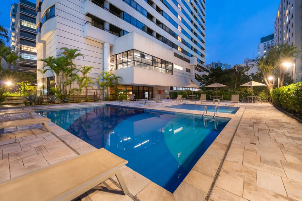 Outdoor pool, open 6:00 AM to 10:00 PM, sun loungers