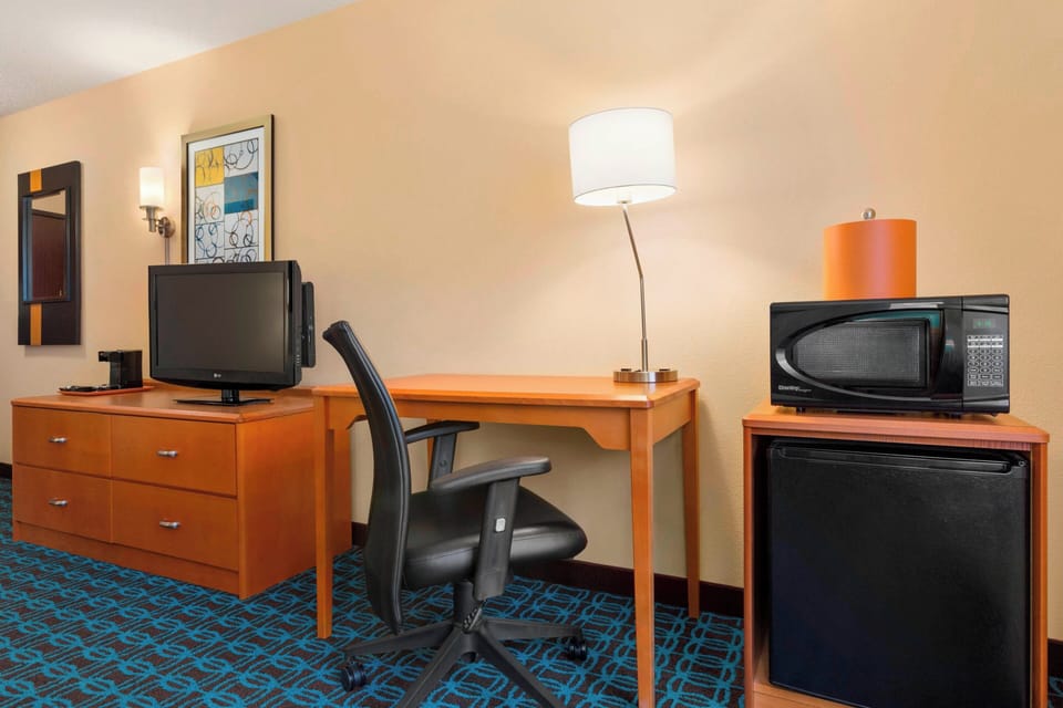 Pillowtop beds, desk, blackout drapes, iron/ironing board