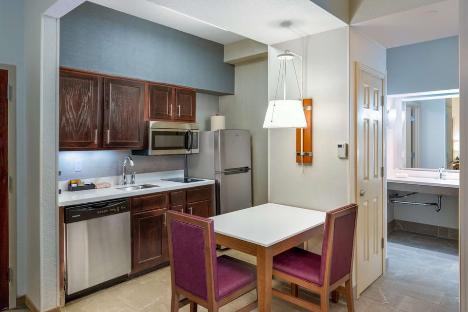 Suite, 1 Bedroom | Private kitchen | Full-size fridge, microwave, stovetop, dishwasher