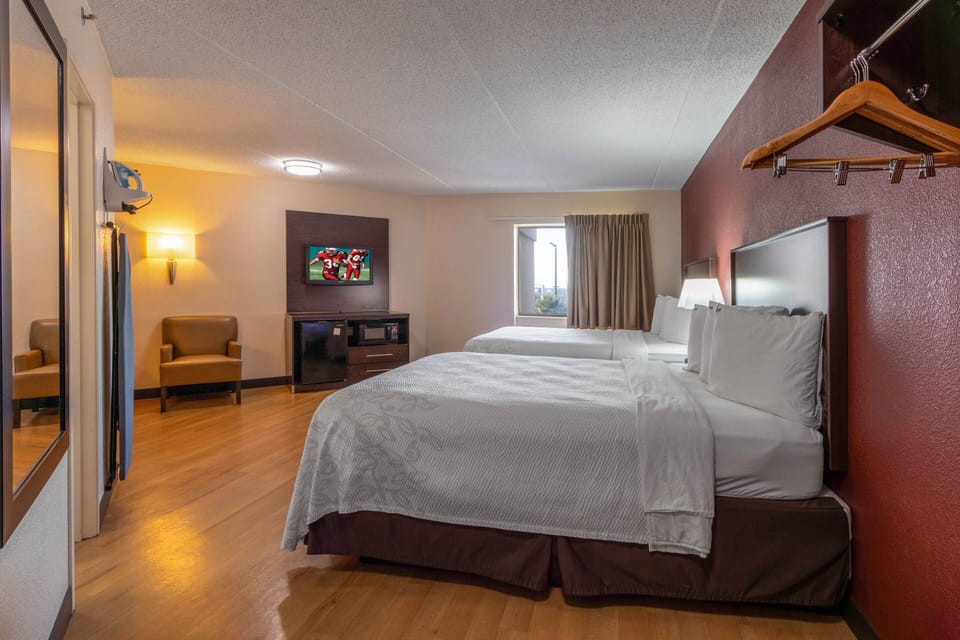 Deluxe Room, 2 Queen Beds (Smoke Free) | Desk, blackout drapes, free cribs/infant beds, free WiFi
