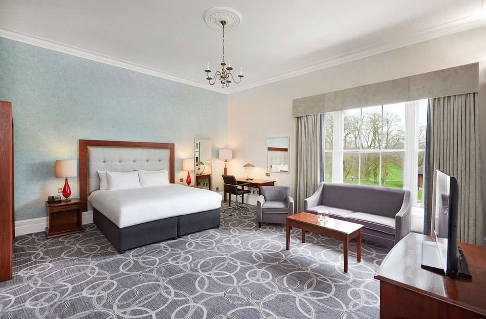 Manor House Deluxe Room with Air Con | Living area | 32-inch LCD TV with digital channels, TV