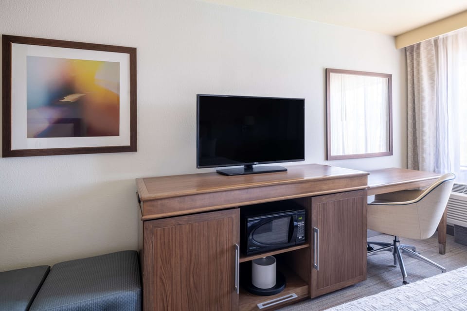 Premium bedding, desk, laptop workspace, iron/ironing board