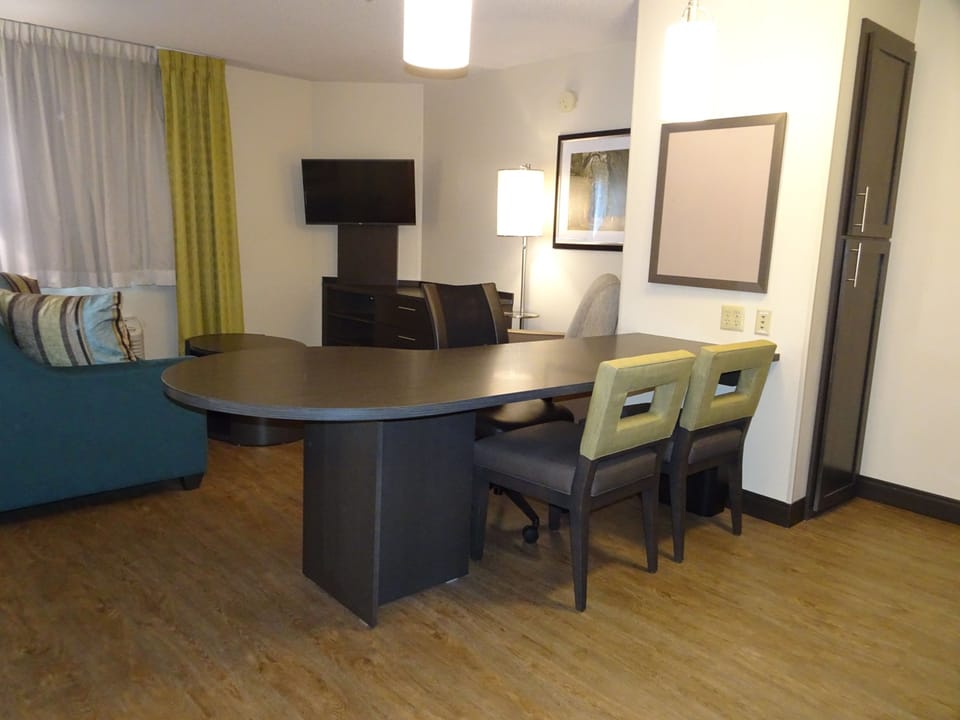 Suite, 1 Bedroom | Desk, laptop workspace, blackout drapes, iron/ironing board