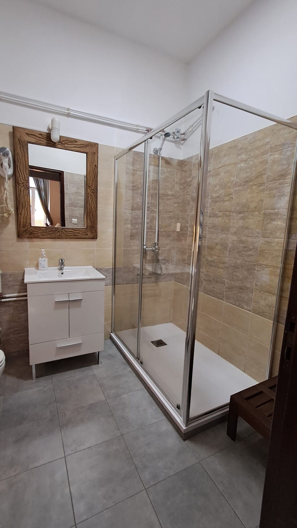 Shower, hair dryer, towels, toilet paper