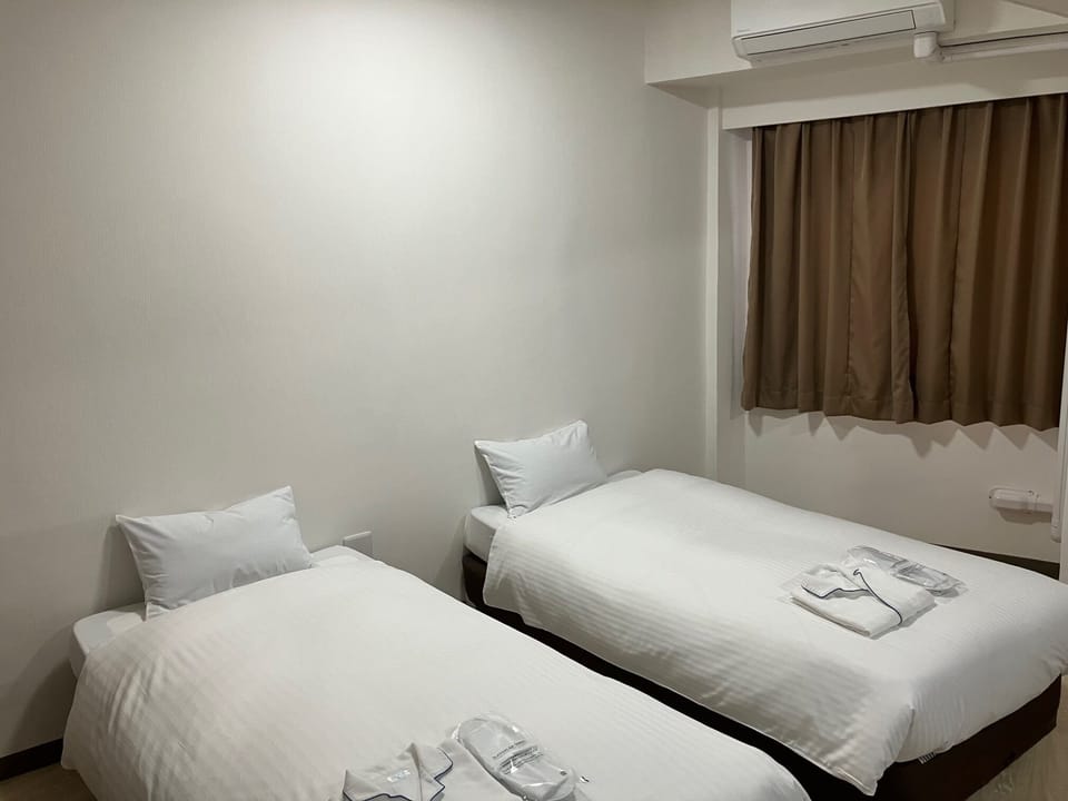 Desk, blackout drapes, WiFi (free), bed sheets