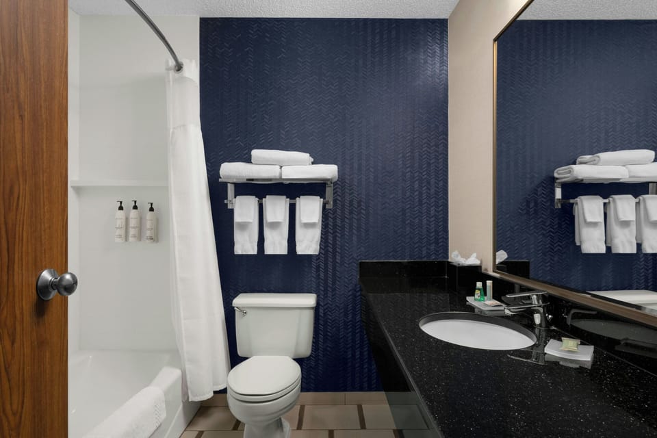 Room, 2 Queen Beds | Bathroom | Combined shower/tub, deep soaking tub, free toiletries, hair dryer