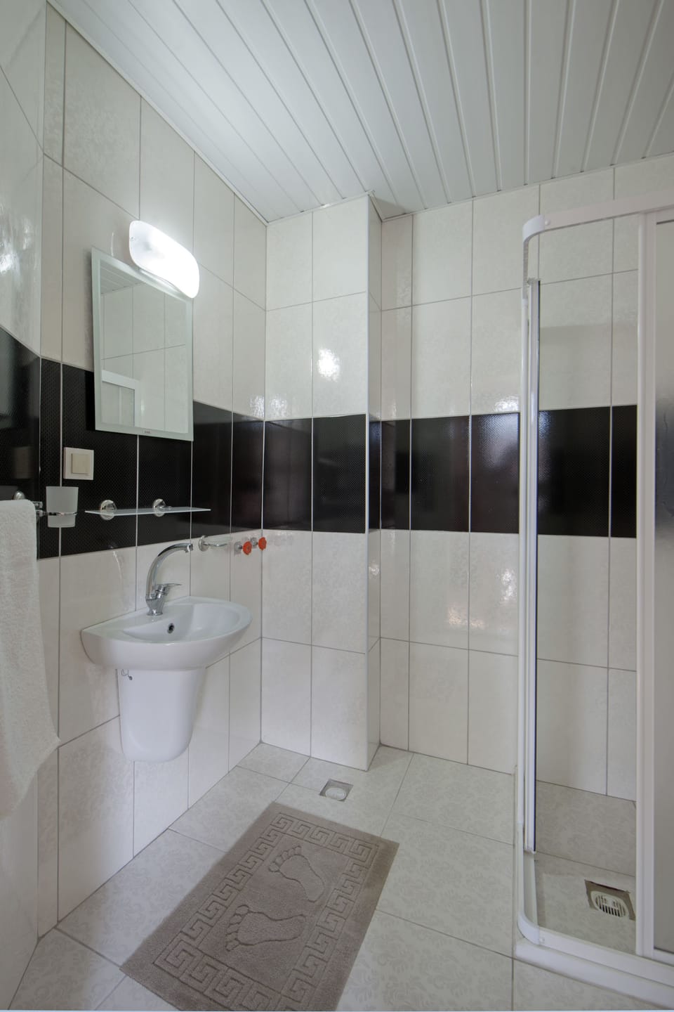 Shower, free toiletries, hair dryer, slippers