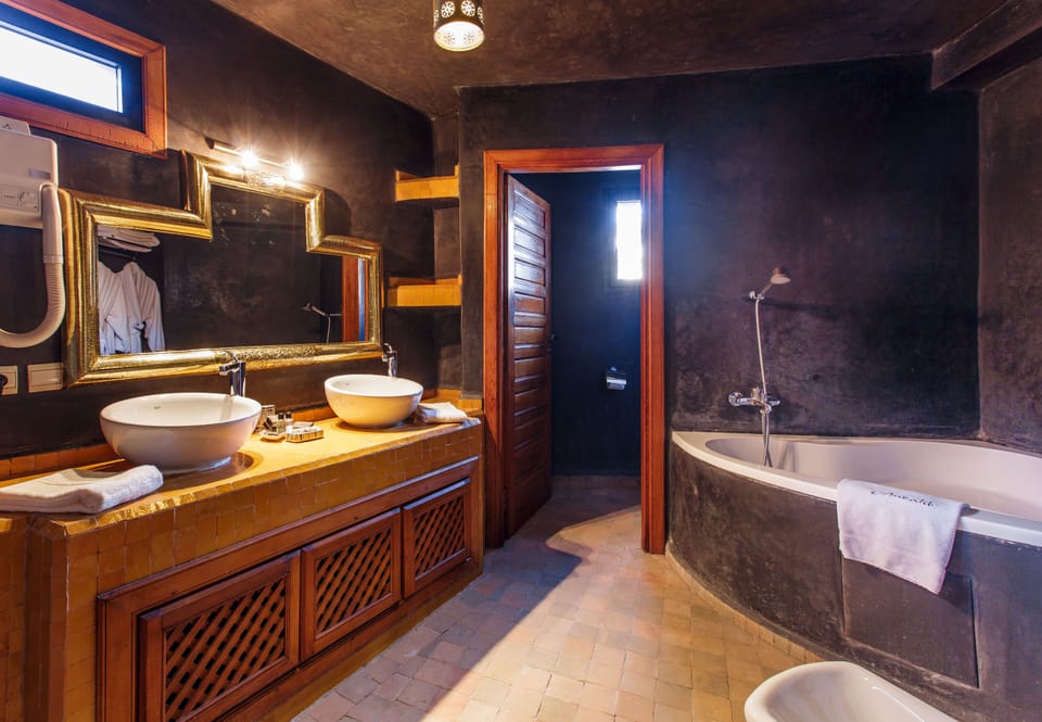 Queen Suite | Bathroom | Separate tub and shower, designer toiletries, hair dryer, bathrobes