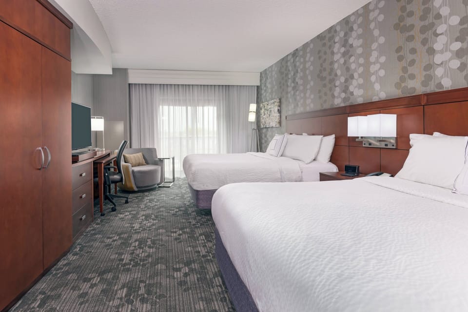 Room, 2 Queen Beds | In-room safe, desk, laptop workspace, blackout drapes